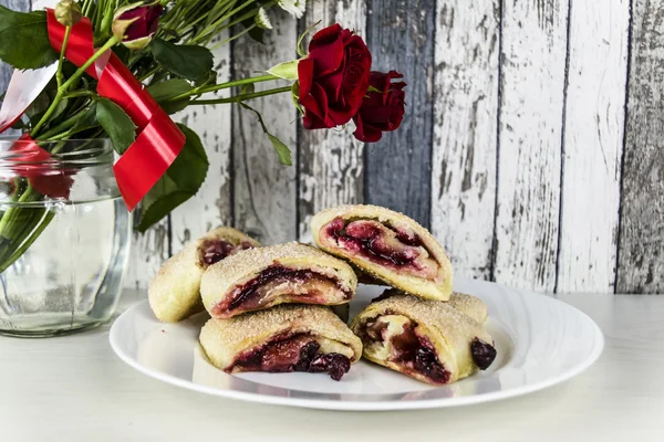 cake with cherry filling and roses