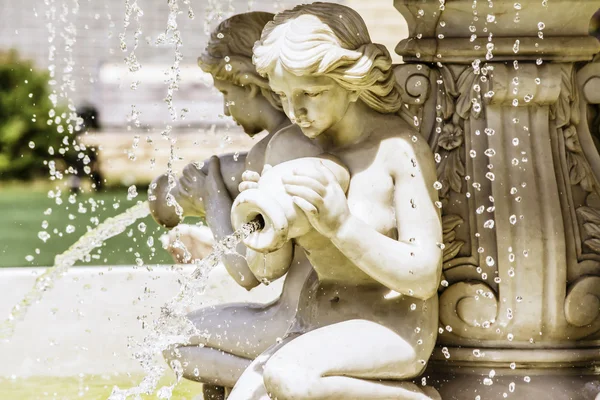 woman pours water from a pot, fountain, vintage, statue