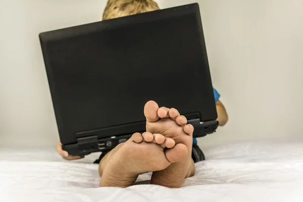 Child playing in the laptop — Stock Photo, Image