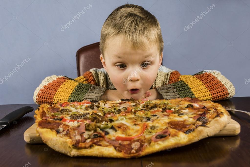 Child eating pizza — Stock Photo © mikitiger 97457364