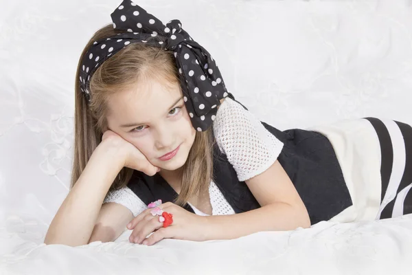 Beautiful little girl looks angry — Stock Photo, Image