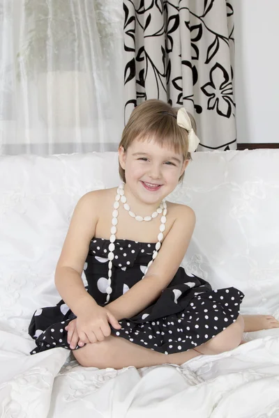 Beautiful girl smiling in a dress — Stock Photo, Image