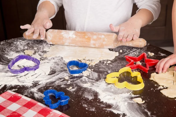 Child cut out cookies for baking — Stock Photo, Image