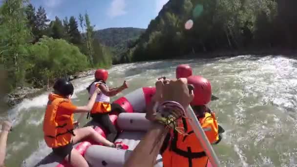 Group of six people white water rafting