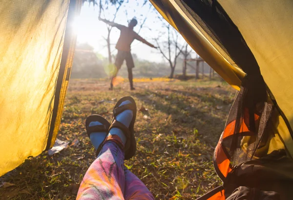 Woman lying in a tent with coffee ,view of mountains and sky — Stock Photo, Image