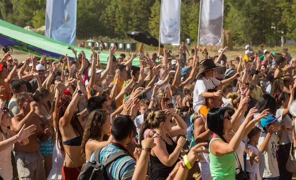 A large number of people in the colorful outdoor festival — Stock Photo, Image