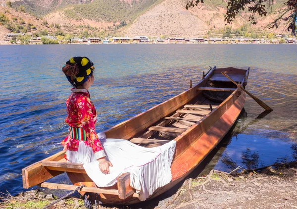 The girl in national dress on the lake — Stock Photo, Image
