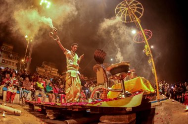 VARANASI, INDIA -  Ganges river and Varanasi ghats during Kumbh Mela festival late evening. clipart