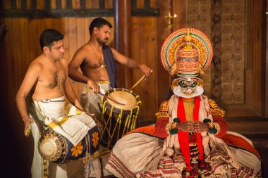 FORT COCHIN, India -  January 10, 2015: Kathakali performer in the virtuous pachcha role in Cochin on January 10, 2015 in South India. Kathakali is the ancient classical dance form of Kerala. clipart