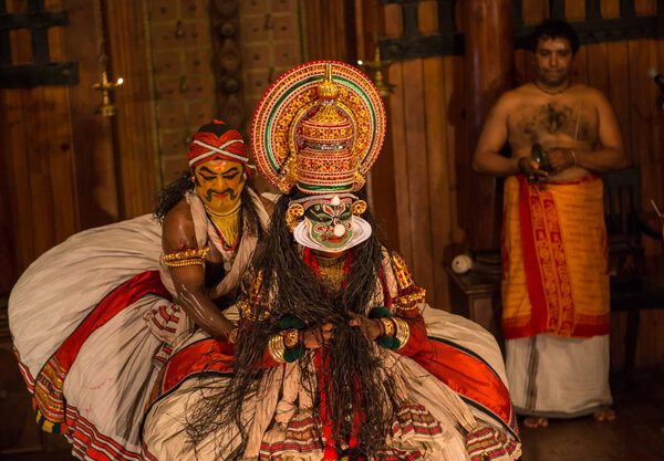FORT COCHIN, India -  January 10, 2015: Kathakali performer in the virtuous pachcha role in Cochin on January 10, 2015 in South India. Kathakali is the ancient classical dance form of Kerala.