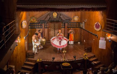 FORT COCHIN, India -  January 10, 2015: Kathakali performer in the virtuous pachcha role in Cochin on January 10, 2015 in South India. Kathakali is the ancient classical dance form of Kerala. clipart