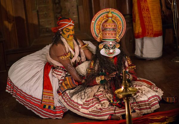 FORT COCHIN, India -  January 10, 2015: Kathakali performer in the virtuous pachcha role in Cochin on January 10, 2015 in South India. Kathakali is the ancient classical dance form of Kerala.