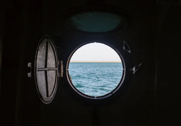 Ship porthole on wooden wall — Stock Photo, Image