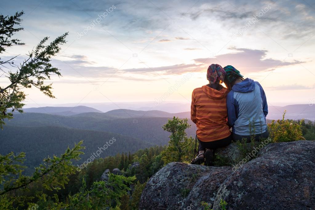 Couple Watching Sunset Mountain Outdoors Concept