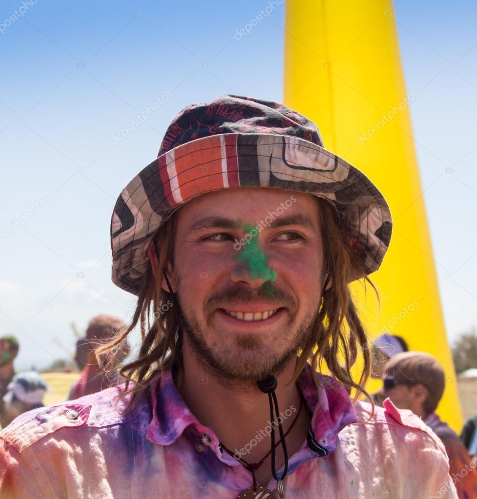 Portrait of a young smiling man on holi color festival