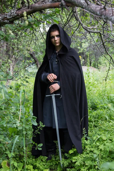 Portrait of a beautiful young warrior holding sword — Stock Photo, Image