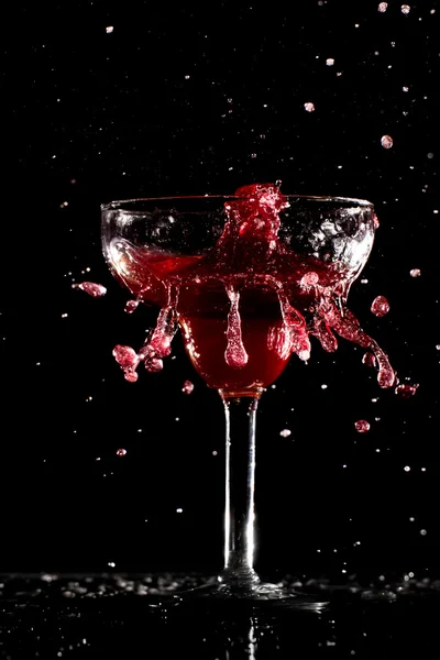 Red alcohol drink splashes — Stock Photo, Image