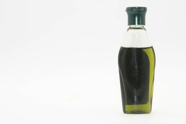 Hårolja Flaska Isolerad Vit Bakgrund Med Selektivt Fokus — Stockfoto