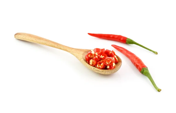 Chilli peppers on wood background — Stock Photo, Image