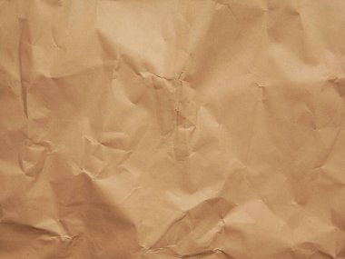 Kahverengi kağıt eski usul buruşmuş. Grafik tasarımı veya duvar kağıdı için mesaj yazmak için eski doku arkaplanı ve boşluk. Sunumlar veya kartpostallar için geçmişe dönük şablon. 