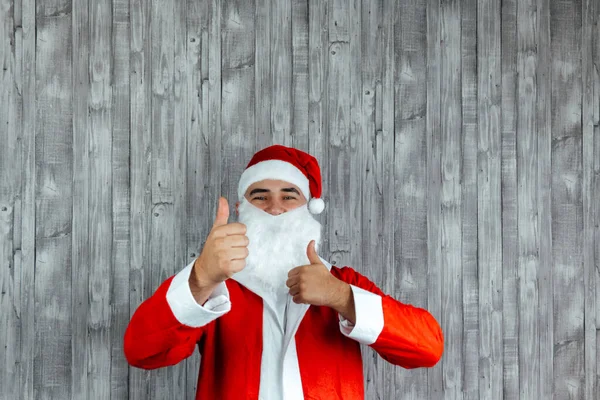 Junger Kaukasischer Junger Mann Als Weihnachtsmann Verkleidet Mit Erhobenen Daumen Stockbild