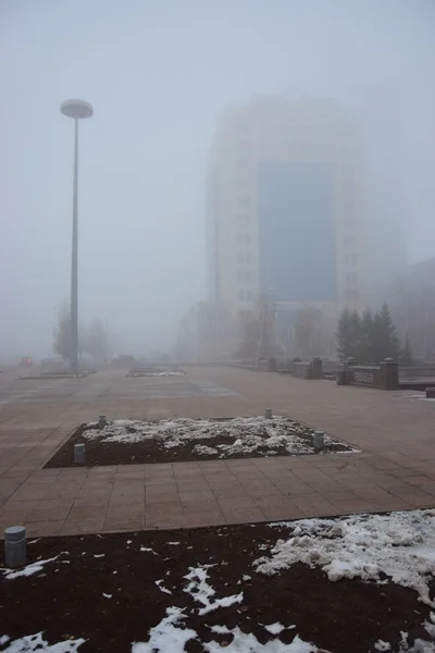 Modern buildings in Astana in thick fog — Stock Photo, Image