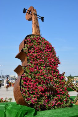 A flowerbed in the form of a violin clipart