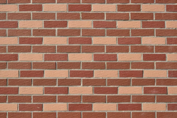 Wall made of red and pink bricks — Stock Photo, Image