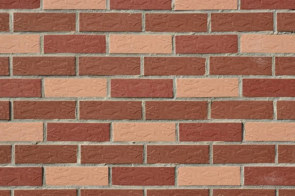 Wall made of red and pink bricks — Stock Photo, Image