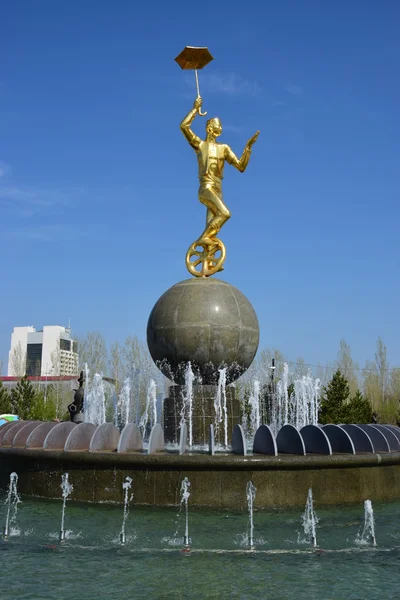 Gilded statue of a circus man on a monocycle in Astana — Stock Photo, Image