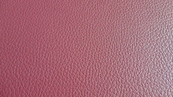 Natural linen texture as pink background. Pink rough textured fabric yarn. Close-up pink old ecru flax fibre seamless pattern