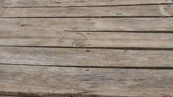 Natural wooden pier texture backgroud. Wooden pier plank background. Warm color of wooden panels on the floor.