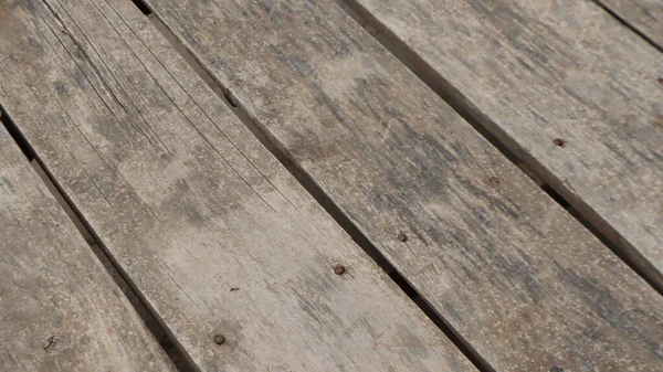 Natural wooden pier texture backgroud. Wooden pier plank background. Warm color of wooden panels on the floor.