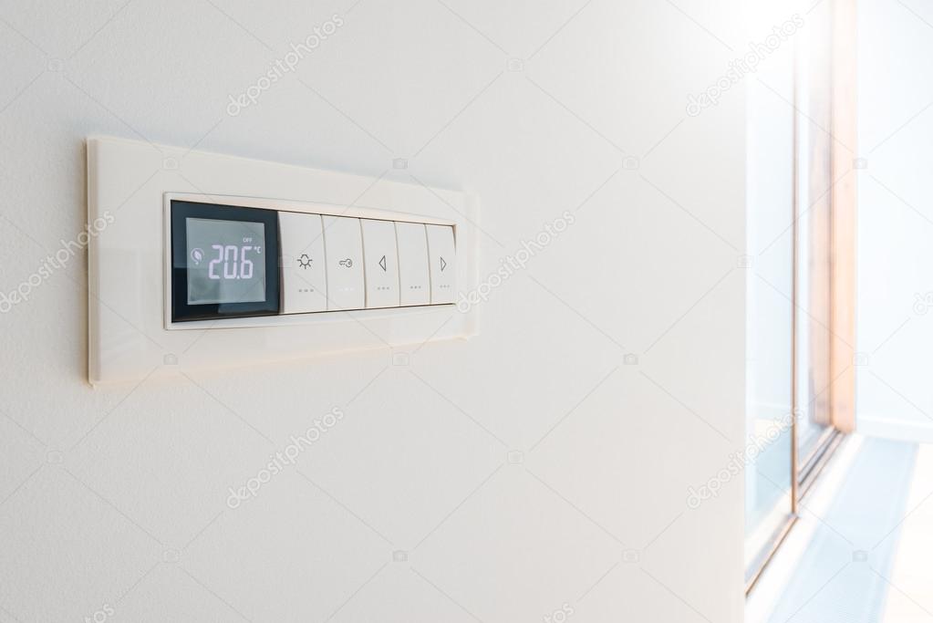 Wall display shows air temperature.