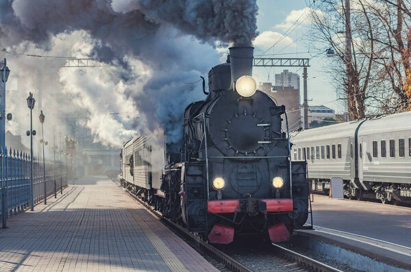 Retro train departs from the platform. Moscow. Russia.