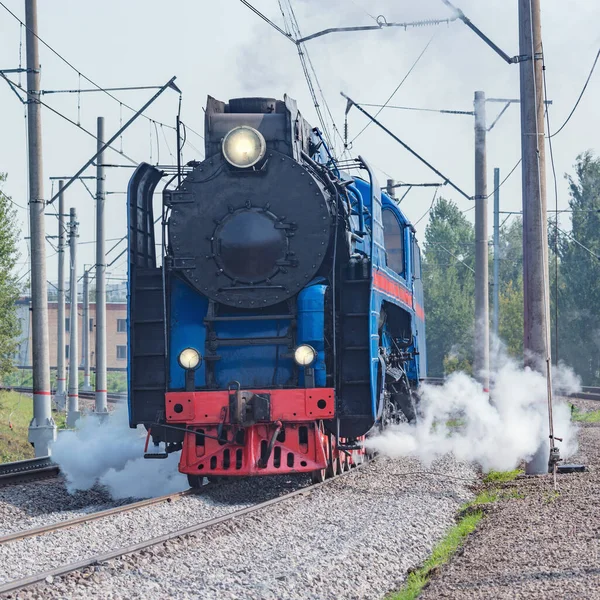 Steam retro train departs from the station. Moscow. Russia.