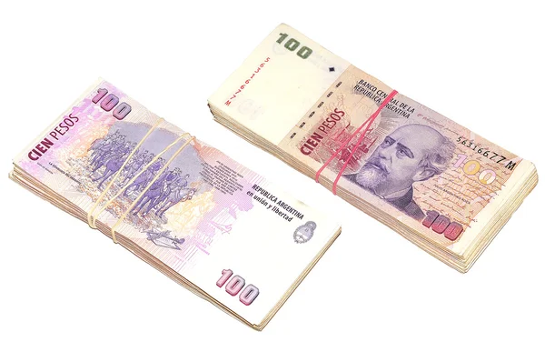 Dos pilas de billetes de cien pesos argentinos . — Foto de Stock