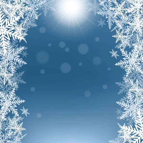 Copos de nieve de Navidad y sol sobre fondo azul . — Vector de stock