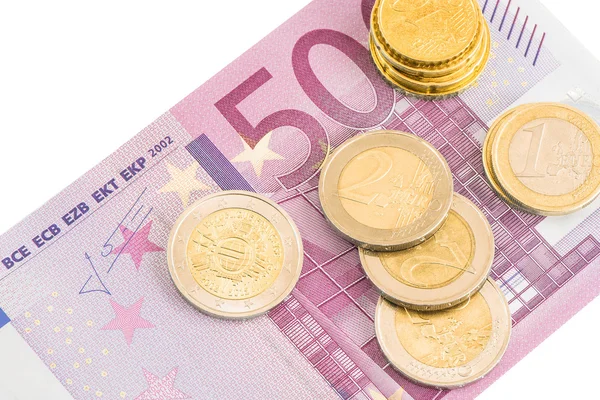 Monedas en euros y quinientos billetes en euros . — Foto de Stock