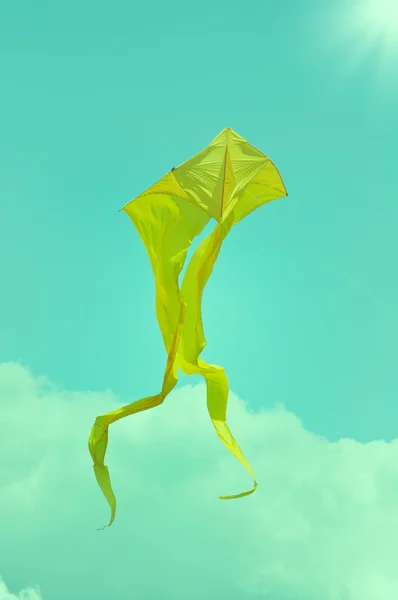 Yellow flying kite on the sky. — Stock Photo, Image