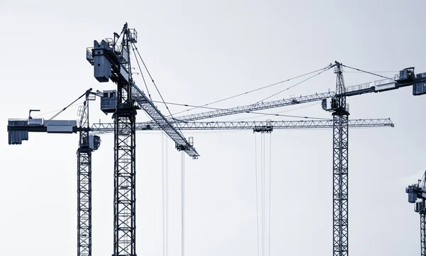 Construction cranes silhouettes. — Stock Photo, Image