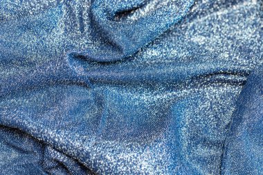 Göz kamaştırıcı bir arka plan. Gümüş renkli parıltı dokusu, Noel tatili, duvar kağıdı dekorasyonu, selamlama ve düğün davetiyesi tasarım unsuru için parlak parlak ambalaj kağıdı arka planı