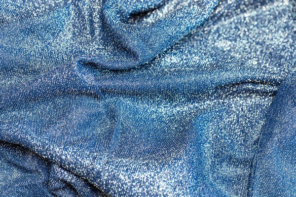 Göz kamaştırıcı bir arka plan. Gümüş renkli parıltı dokusu, Noel tatili, duvar kağıdı dekorasyonu, selamlama ve düğün davetiyesi tasarım unsuru için parlak parlak ambalaj kağıdı arka planı