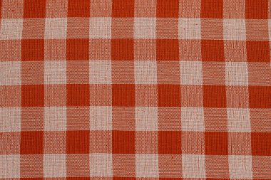 Damalı kırmızı masa örtüsü olan tekstil arka planı, üst görünüm. Doğal keten kumaş dokusu. Seçici odaklanma. Uzayı kopyala Yiyecek ve içecek için bir yer. Restoran, menü