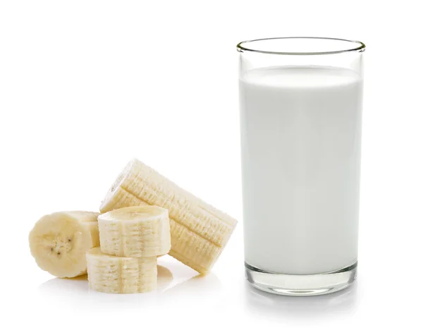 Banan och färsk mjölk i glaset på vit bakgrund — Stockfoto