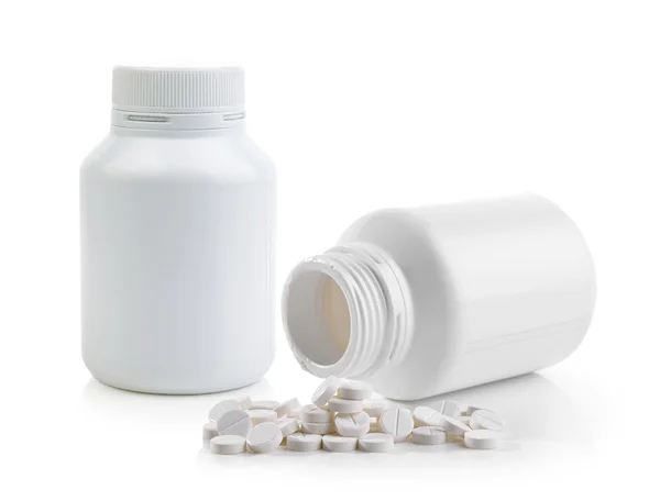 Comprimidos derramando fora da garrafa pílula — Fotografia de Stock