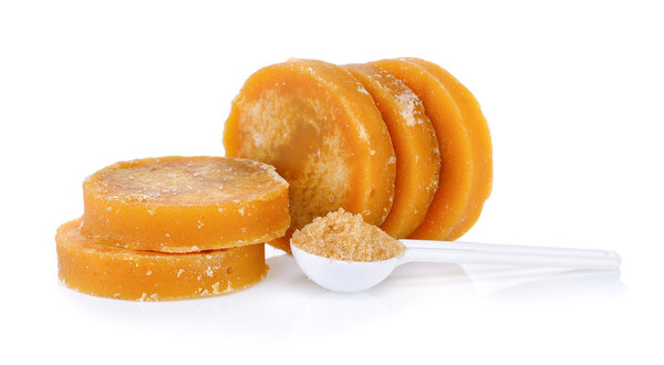 Sugarcane Hard Molasses or Jaggery and sugar in spoon