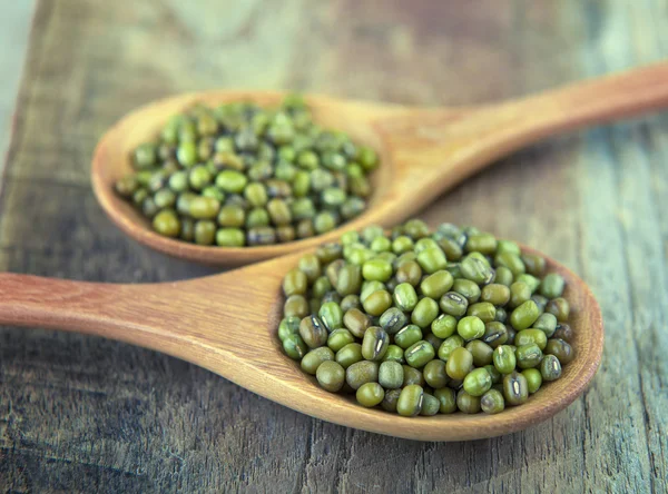 organic mungbeans in wood spoon