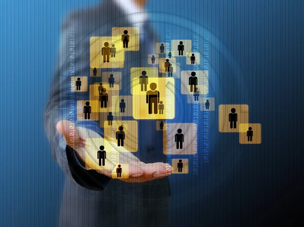 Businessman holding a group of business people — Stock Photo, Image