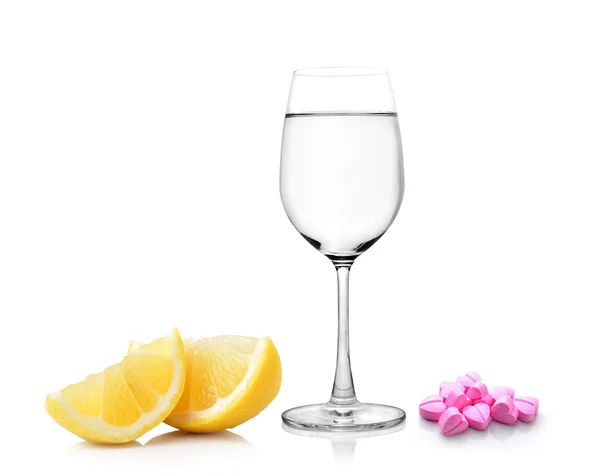 Lemon glass of water and pills isolated on white background — Stock Photo, Image